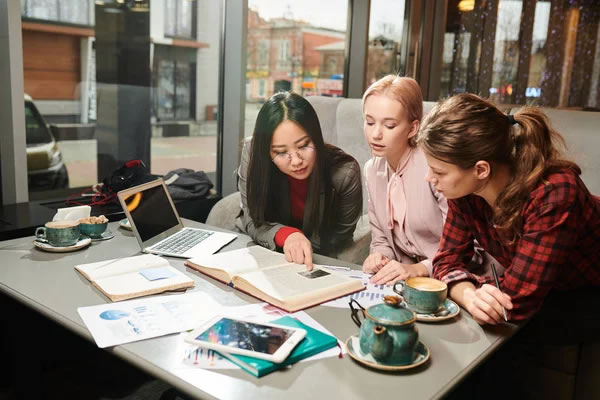 group-classmates-sitting-table-cafe.jpg